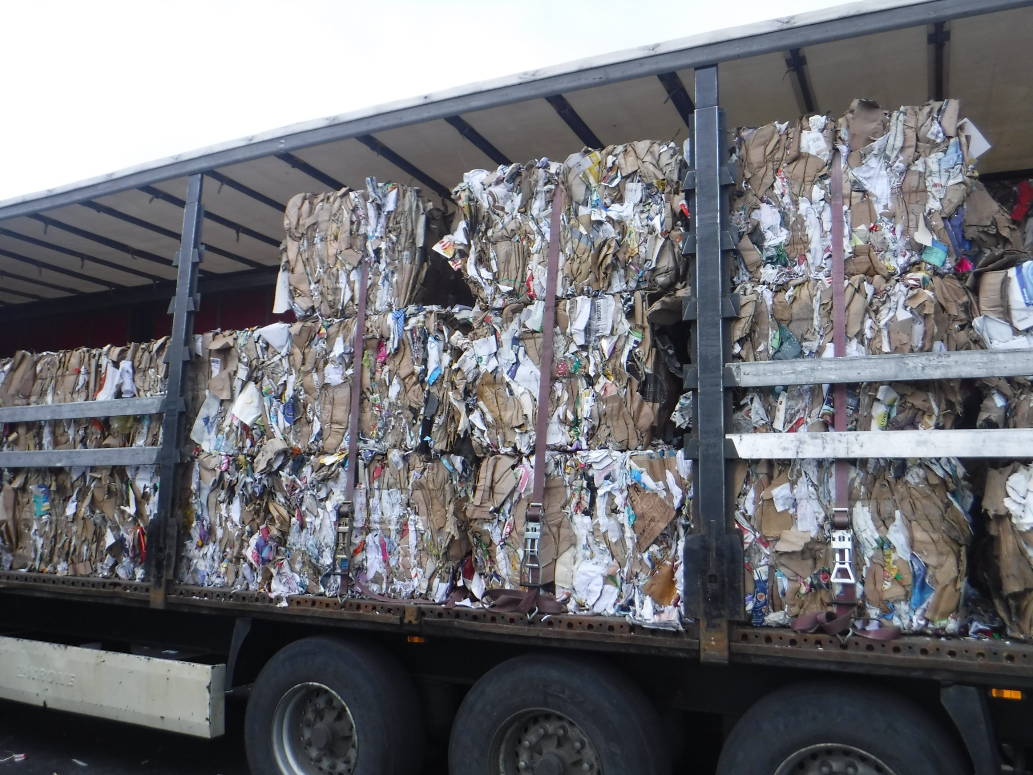 Lorry loaded with bales of hard mixed paper