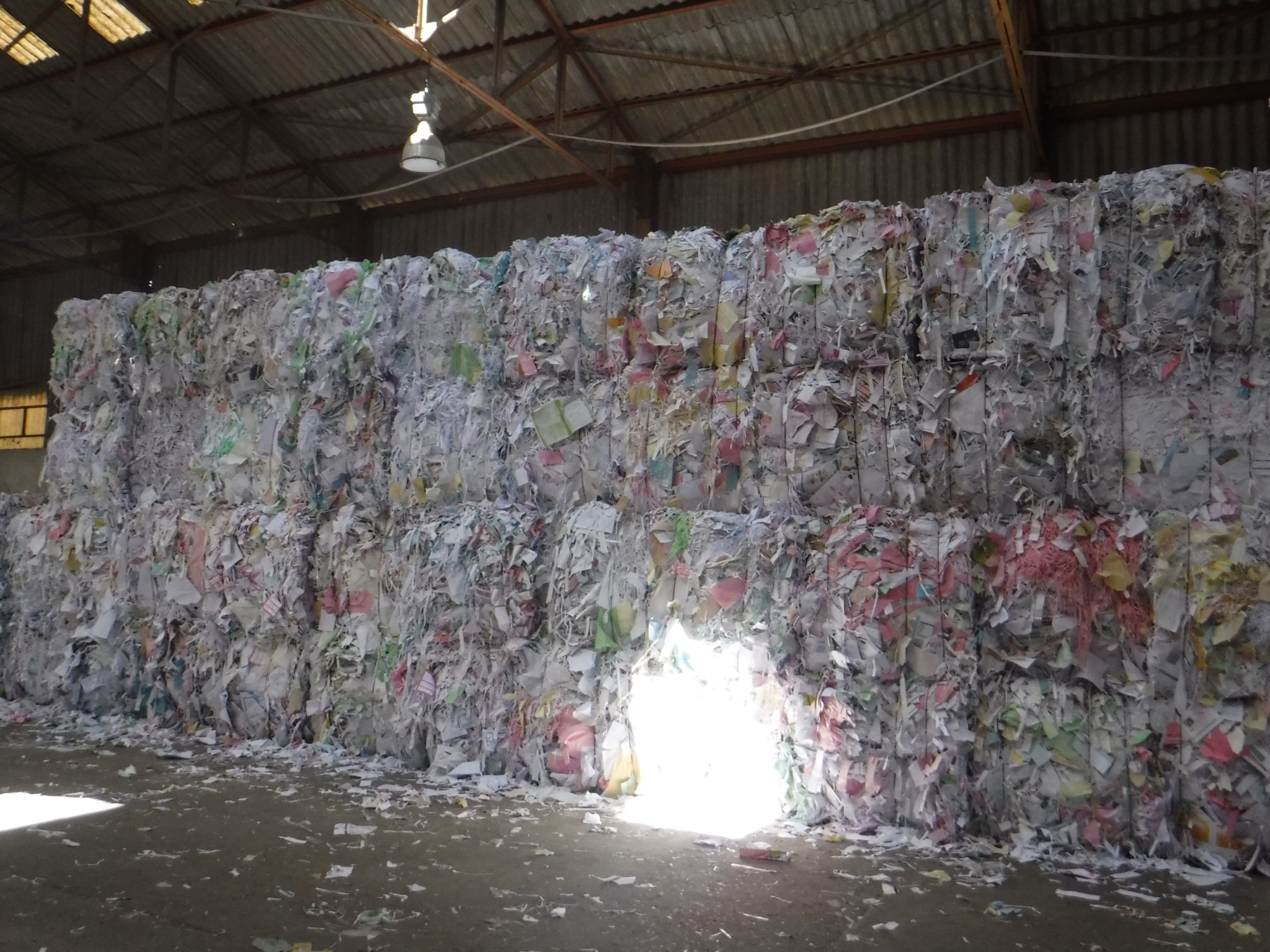 Bales of CHL coloured heavy letter paper in a warehouse